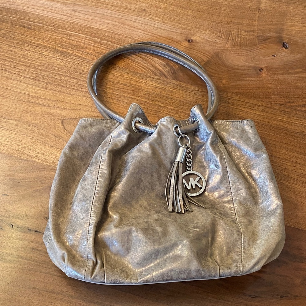 Michael Kors East West Ring Bag in a metallic, distressed leather
